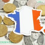 France flag on coins background finance and accounting banking concept